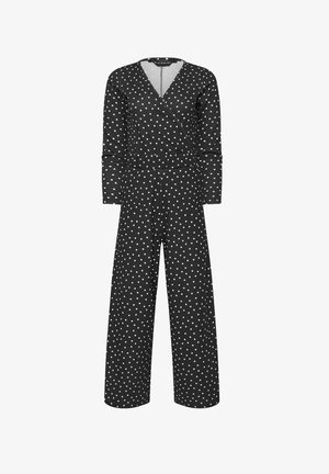 Combinaison noire à manches longues avec des pois blancs, col en V style portefeuille, taille ajustée et pantalons à jambes larges.