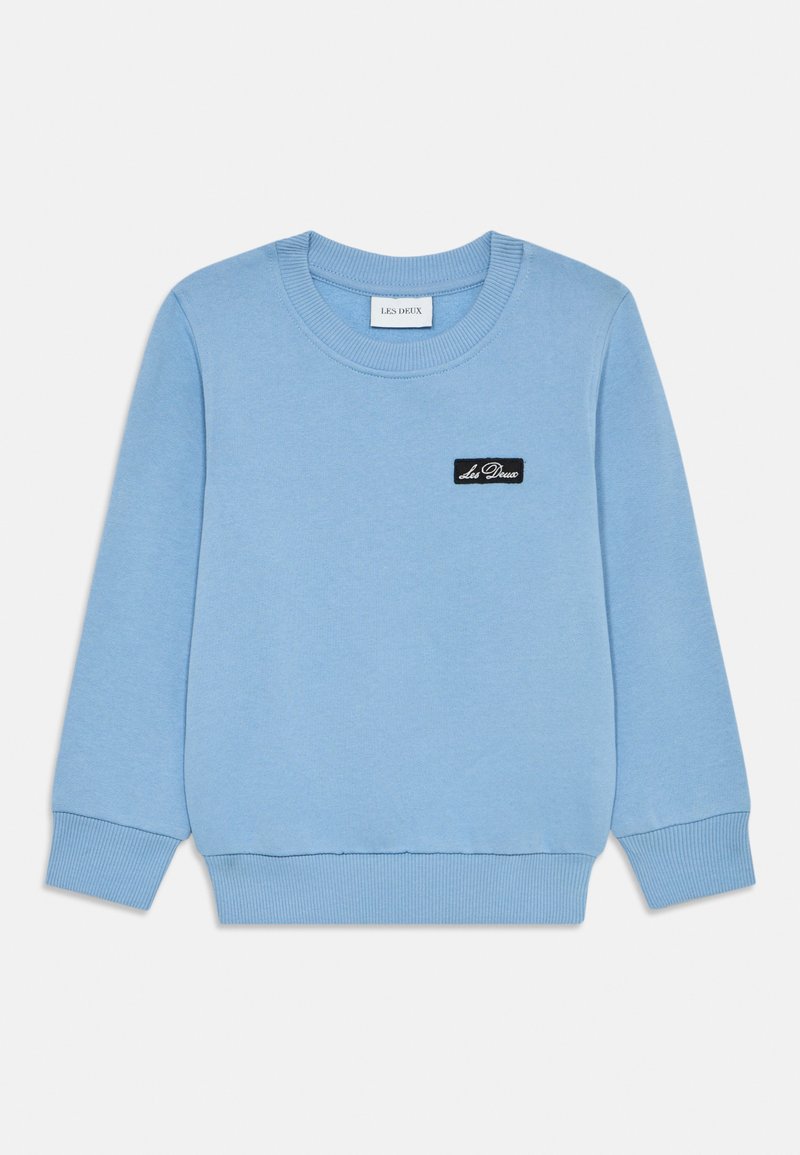 Light blue sweatshirt made of cotton, featuring a round neckline, ribbed cuffs and hem, and a small black label with "Les Deux" on the front.