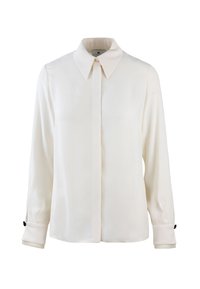 Blusa bianca a maniche lunghe con colletto a camicia, caratterizzata da una leggera lucentezza, maniche con polsini e dettagli in bottone neri sui polsini.