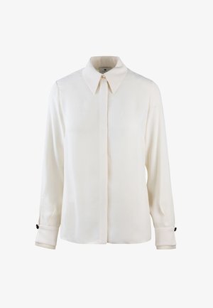 Blusa bianca a maniche lunghe con colletto a camicia, caratterizzata da una leggera lucentezza, maniche con polsini e dettagli in bottone neri sui polsini.