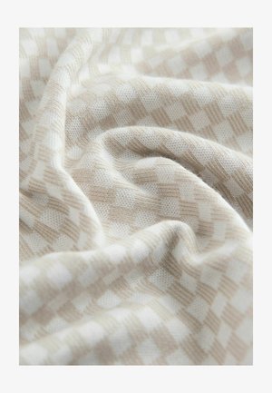 helebeež õmmeldud kangas ruudulise mustriga; pehme tekstuur, õrnad voltide ja kaunite toonide ning koekoha vaheldustega.