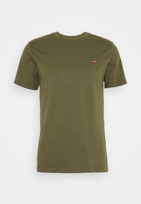 Olivově zelené bavlněné tričko s krátkým rukávem, kulatým výstřihem a malým červeným logem Levi's na levé části hrudi. Jednoduchý, klasický design.