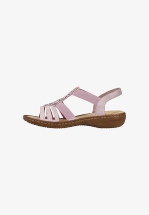 Pink sandal featuring a cross-strap design, cut-out accents, and beaded detailing on the upper. Soft material with a molded heel.