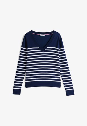 Pull bleu marine avec un col en V, des manches longues et des rayures blanches horizontales. Texture douce avec un petit logo sur la poitrine.