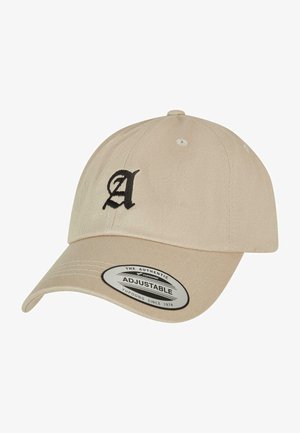 Beige, állítható pamut sapka fekete hímzett "A" logóval és struktúrált koronával. Görbített napernyővel és szellőzőlyukakkal rendelkezik.