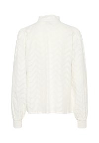 Witte blouse met lange mouwen, gestructureerd zigzagpatroon en gerimpelde halslijn. Heeft elastische manchetten voor een getailleerde look.