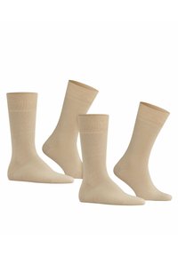 Calzini in cotone beige in confezione da quattro. Caratterizzati da un polsino a coste, una consistenza liscia e una lunghezza che va dalla caviglia a metà polpaccio. Adatti per un abbigliamento casual.