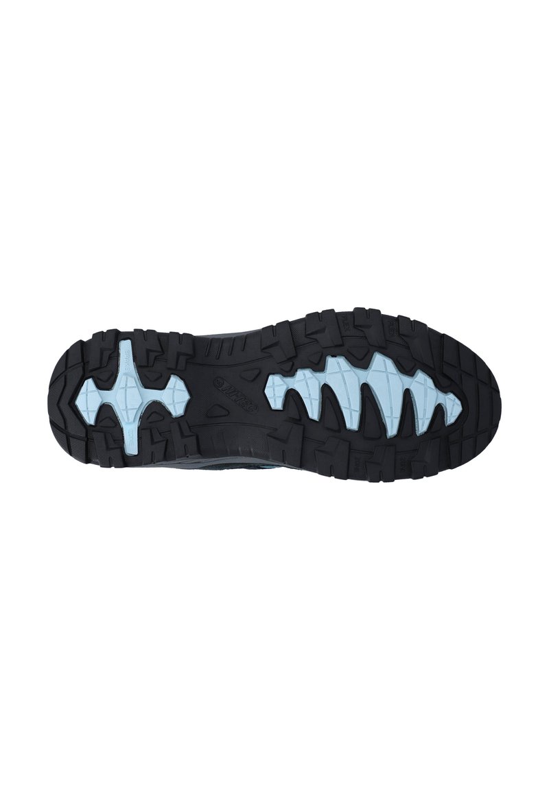 Schwarze Gummi-Außensohle mit strukturiertem Muster und blauen Akzenten. Entwickelt für Traktion mit tiefen Rillen und unterschiedlichen Formen.