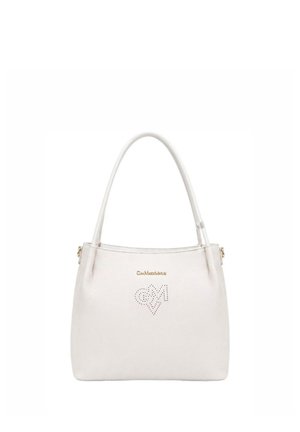 White leather handbag with double handles, gold brand logo, and decorative perforated heart and letter M on front.