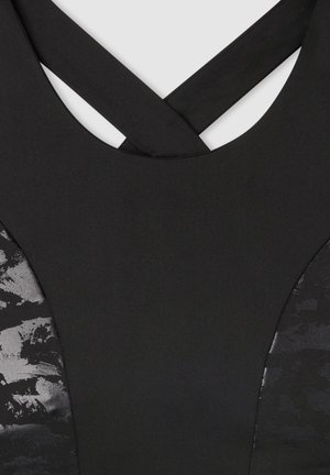 Top atletico nero con design a incrocio sul retro. Tessuto liscio con finitura opaca e motivo testurizzato nero sui lati.