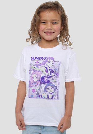 White cotton t-shirt featuring a purple graphic design with four cartoon characters in different poses, labeled with names.