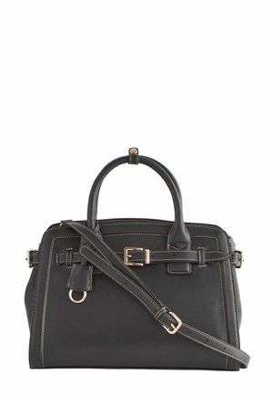 Sac à main en cuir noir avec poignées supérieures, bandoulière réglable, boucles dorées et surpiqûres blanches contrastantes.