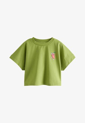 Grünes, kurzärmeliges, bauchfreies T-Shirt mit einer kleinen rosa Cartoon-Chili-Pfeffer-Figur auf der linken Brust.
