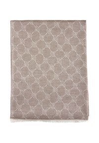 Beżowa tkanina tkana z powtarzającym się okrągłym wzorem w kolorze białym z frędzlami na brzegach. Lekki, teksturowany materiał odpowiedni do różnych zastosowań.