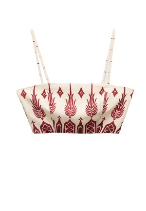Top corto a fantasia bordeaux con spalline sottili su sfondo crema. Presenta motivi floreali e geometrici, silhouette leggermente strutturata.