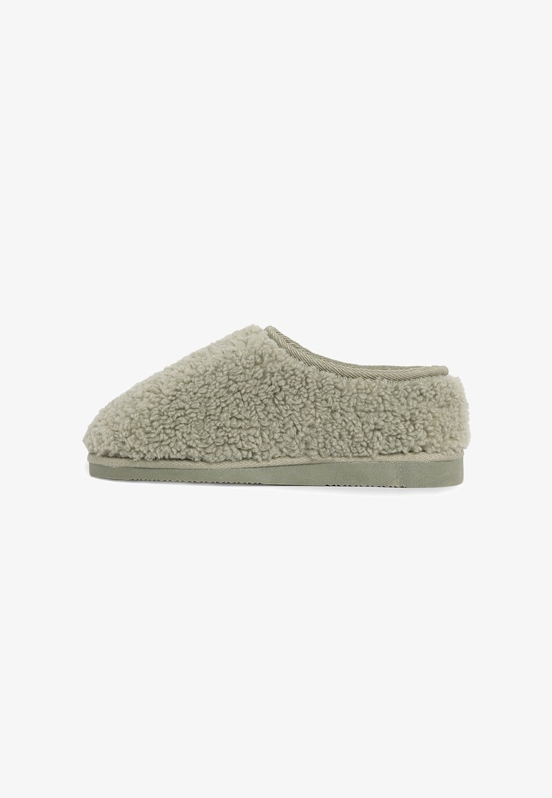 Light gray slip-on slipper with soft, fluffy texture and flat rubber sole, shown from the side on a white background.