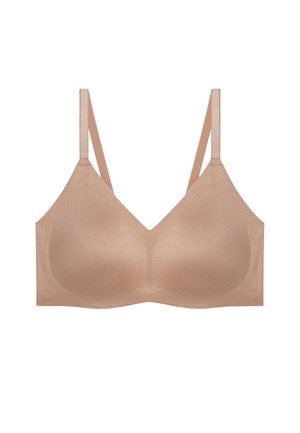 Soutien-gorge beige clair, sans coutures, avec une texture lisse, des bretelles réglables et un design simple. Aucun matériel ou ornement visible.