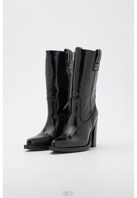 Black patent leather ankle boots with a sleek design, pointed toe, and high chunky heel. Features side stitching and pull tabs.