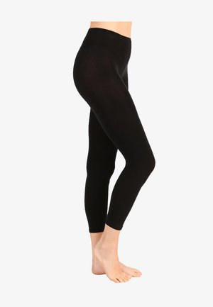 Schwarze Leggings aus dehnbarem Stoff, figurbetontes Design und elastischer Taillenbund. Die Länge reicht bis zum Knöchel und die Textur ist glatt.