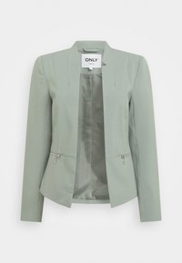 Blazer ajusté vert clair avec une ouverture à l'avant, manches longues, deux poches zippées et intérieur en satin.