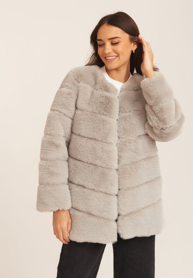 Gray faux fur coat featuring horizontal stripes, a round neckline, and long sleeves, providing a soft and textured appearance.