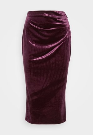 Burgundy velvet pencil skirt with a draped design and smooth texture; features a high waist and tapered silhouette, ending at knee length.