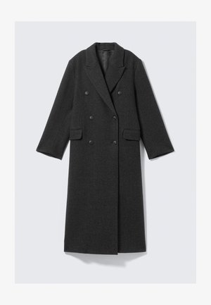 Tumehall villane mantel, topelt nööpidega disain, kergelt tekstureeritud kangas, sälk-krae ja kaks esipocketi. Pikad varrukad ja põlveliini pikkus.