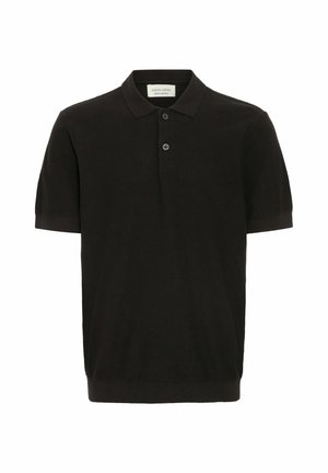 Polo shirt nero a maniche corte con finitura texturizzata, pattina con tre bottoni e colletto classico. Presenta un orlo a costine aderente.