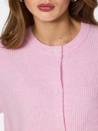 Light pink cardigan made of soft, textured knit. Features a round neckline and three transparent buttons along the front.