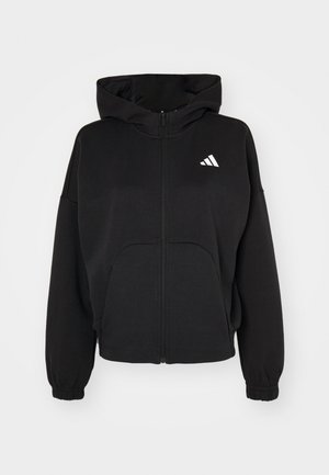 Black zip-up hoodie made of soft fabric, featuring a large front pocket, elasticated cuffs, and a white logo on the left chest.
