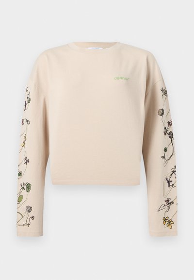 Μπεζ cropped φούτερ με μακριά μανίκια, με μινιμαλιστικά λουλουδάτα σχέδια στα μανίκια και μικρό πράσινο λογότυπο "Off-White" στο στήθος.