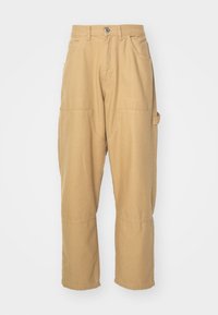 Beige cargo pants made of cotton blend fabric. Features multiple pockets, straight legs, and a button closure at the waistband.