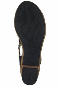 Zwarte rubberen schoenzool met een gestructureerd oppervlak, licht verhoogde patronen en een natuurlijke kurken tussenzool. Heeft een gladde rand en een logo-afdruk.