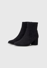 Black suede ankle boots with a pointed toe, elastic side panels, and a block heel. The texture is smooth with a matte finish.