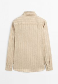 Beige striped long-sleeve shirt made of textured fabric with a button-down collar, featuring light vertical stripes and button cuffs.