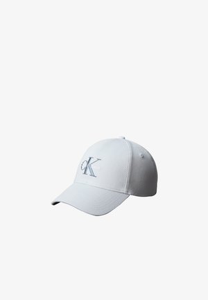 Casquette de baseball blanche avec une visière courbée et le logo Calvin Klein "cK" brodé sur le panneau avant.