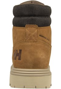 Brown waterproof leather boot with a rolled black fabric collar, reinforced stitching, and a textured rubber sole. Features a logo on the heel.