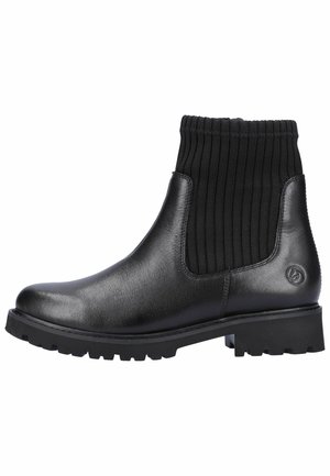 Botines de cuero negro con puño de tela negra acanalada, punta redonda y suela de goma texturizada con tacos profundos para mayor agarre.