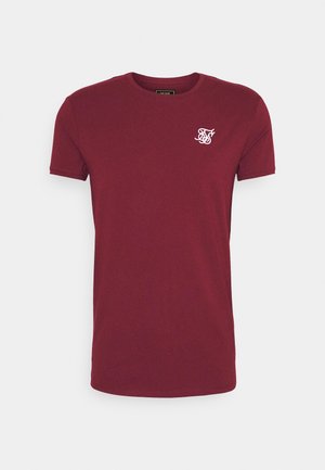 Vinrød kortærmet t-shirt lavet af bomuld med rund halsudskæring og en lille hvid broderet logo på venstre brystområde.