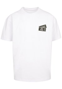 White cotton t-shirt with short sleeves featuring a graphic of ski pass tickets in black and gray on the left chest area.