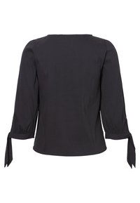 Blusa nera con maniche lunghe, polsini arricciati legati con fiocchi e orlo dritto. Realizzata in un tessuto testurizzato con un delicato motivo a righe.