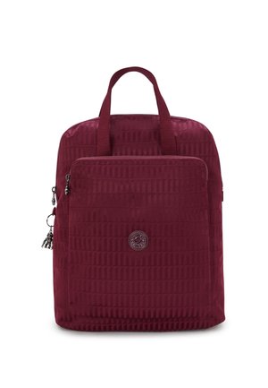 Burgundy backpack with a textured surface, featuring dual top handles, a front zip pocket, and a circular logo detail.