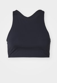 Temno modra športna crop top majica z okroglo izrezom, izdelana iz raztegljivega materiala. Ima gladko teksturo in brez vidne opreme ali vzorcev.