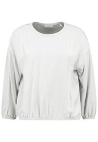 Light gray long-sleeve top with a round neckline, gathered cuffs, and an elasticized hem. Smooth texture with slight sheen. No visible patterns.