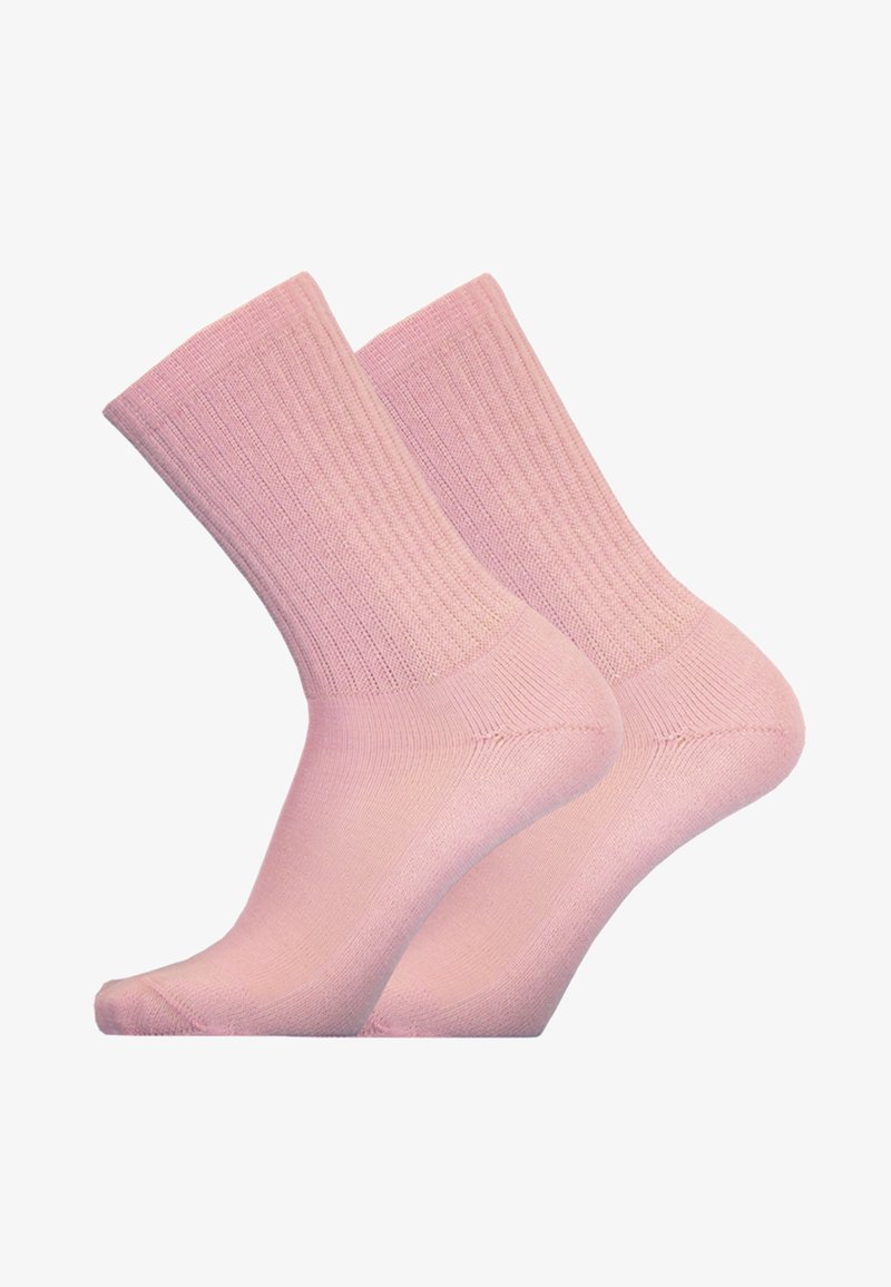 Light pink crew socks made from a soft, ribbed fabric, featuring a seamless toe and a standard cuff height.