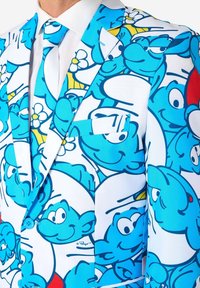 Blue and white suit jacket featuring a pattern of cartoon Smurfs, with a notched lapel and a single chest pocket. Smooth fabric texture.