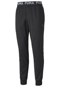 Schwarze Puma-Jogginghose mit elastischem Bund, featuring "PUMA"-Text, schmal zulaufenden Beinen und elastischen Bündchen an den Knöcheln.