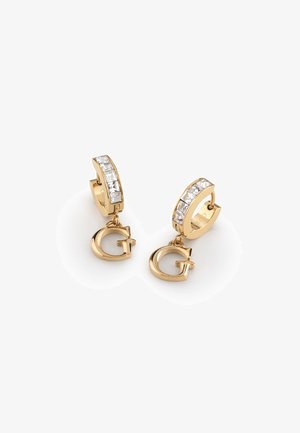 Gold hoop earrings with a row of clear rectangular crystals and a dangling gold "G" charm. Smooth texture with polished finish.