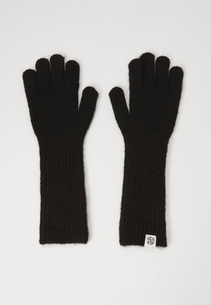 Sorte strikkede hansker med ribbet tekstur, lang lengde og et lite logo merket på håndleddet. Mykt materiale gir varme og komfort.