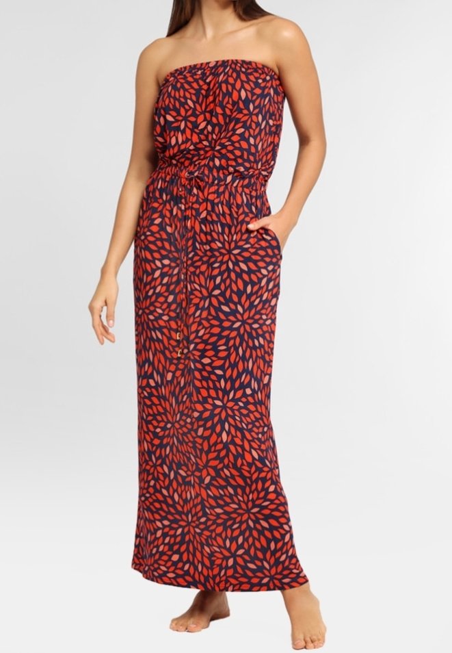 Maxi šaty v námořnické modři s červeným listovým vzorem, korzet bez ramínek, elastický pas a boční kapsy. Proudná látka s hladkou texturou.
